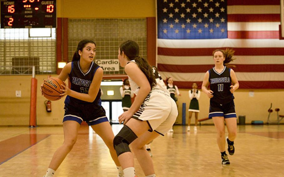 Brussels' Adelaide Duffy-Olivera looks for a pass during a DODEA-Europe Division III basketball semifinal game Feb. 17, 2023, in Baumholder, Germany.