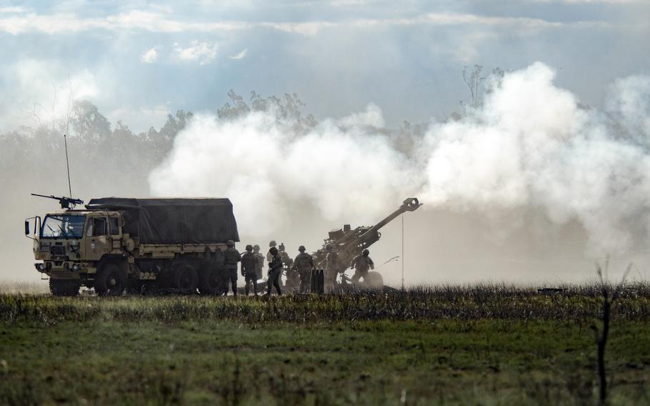 U.S. troops fire a lightweight howitzer, the M-777A2, during a Talisman Sabre drill at the Shoalwater Bay Training Area in Queensland, Australia, Saturday, July 22, 2023.