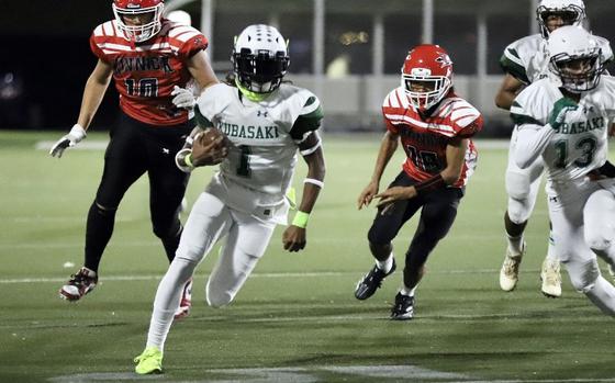 Kubasaki senior quarterback Carlos Cadet (1) is headed to Carroll University in Waukesha, Wis., to play football and run track.