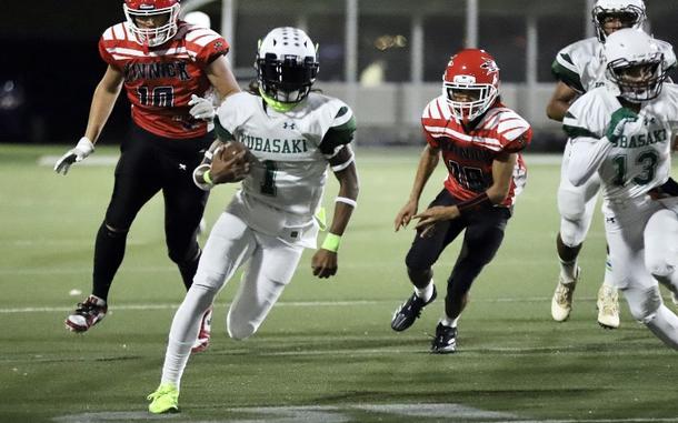 Kubasaki senior quarterback Carlos Cadet (1) is headed to Carroll University in Waukesha, Wis., to play football and run track.