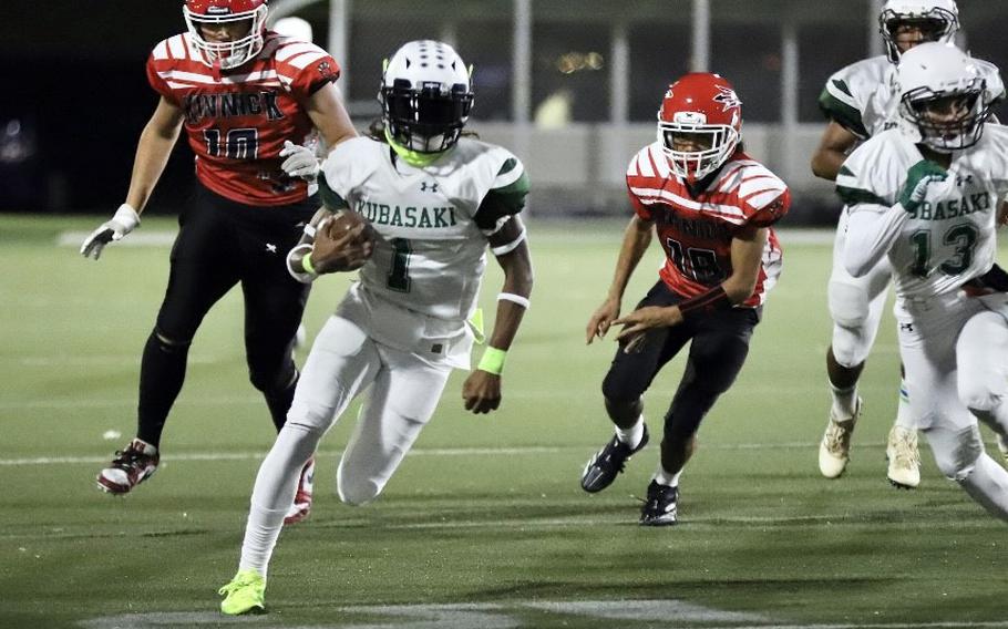 Carlos Cadet runs with the football.