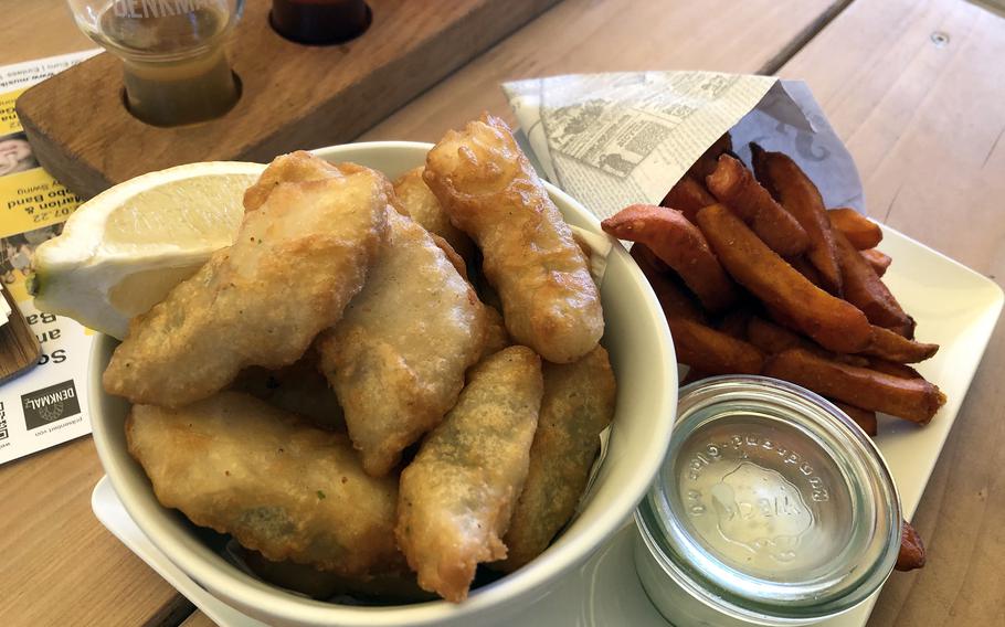 Fish and chips is on the menu in the Denkmalz’s beer garden, next to the company’s chapel restaurant and brewery inside a restored 600-year-old monastery in Bad Sobernheim, Germany.