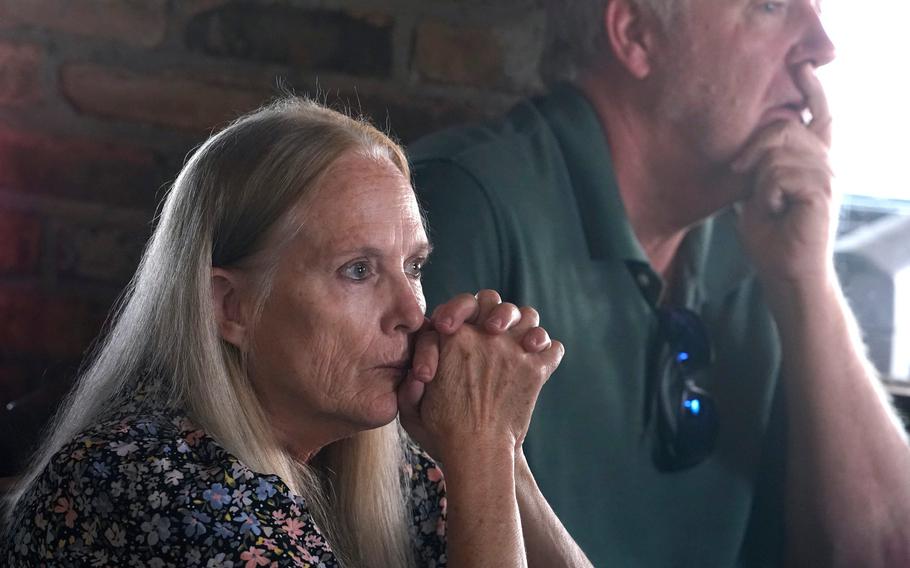 Karen Anderson listens to a story during a gathering of the Gold Star Mothers and Families in New Smyrna Beach, Fla., Sept. 18, 2021.