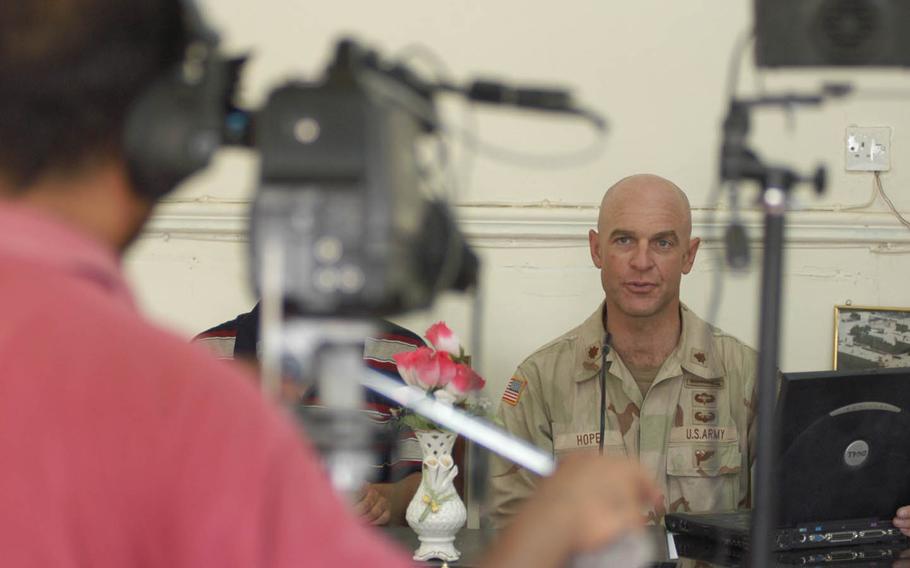A Marine gives a television broadcast