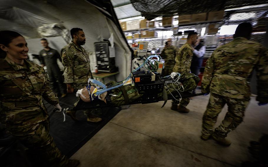 An Air Force medical evacuation team practices patient transport procedures in a training facility at Landstuhl Regional Medical Center May 10, 2023. U.S. European Command has requested $22 million to replace an outdated aeromedical evacuation center at Ramstein Air Base, citing risks of equipment malfunctions and insufficient space for medical teams in crisis situations.