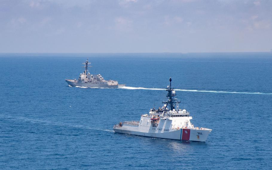 Legend-class U.S. Coast Guard National Security Cutter Munro transits the Taiwan Strait during a routine transit with Arleigh-burke class guided-missile destroyer USS Kidd on Aug. 27, 2021. 