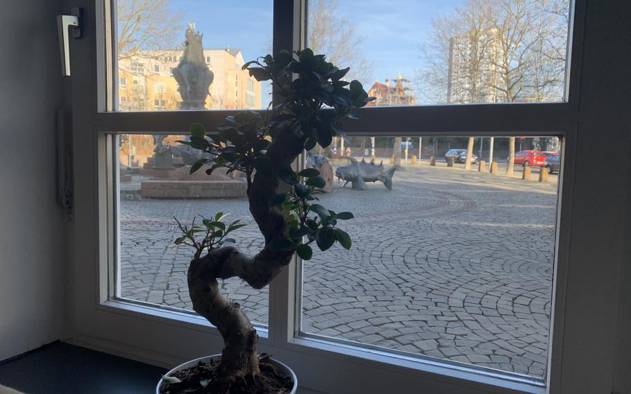 A view of the Kaiserbrunnen fountain in downtown Kaiserslautern, Germany, from one of the many windows in the Yunmi restaurant.