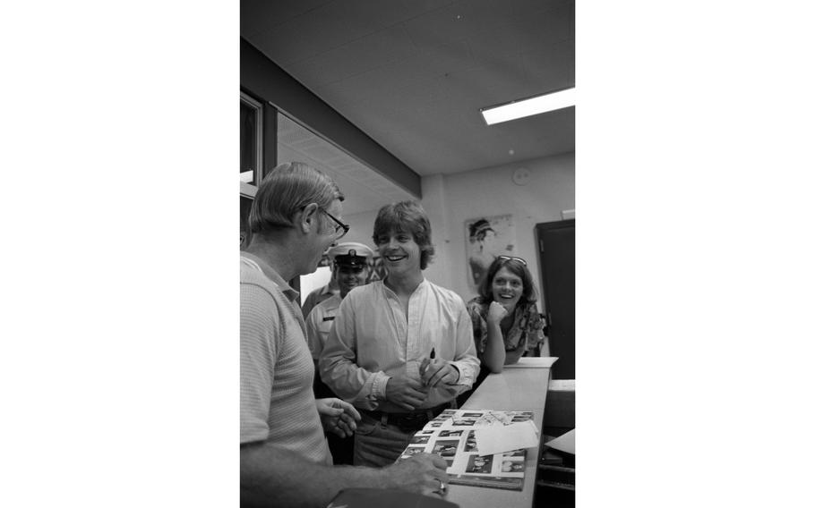 Mark Hamill chats and signs yearbooks and other items for students and staff of Nile C. Kinnick High School.