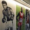 Photographs of Muhammad Ali, left, Carl Lewis, center, and Sergei Bubka are displayed during an exhibition on Wednesday, March 27, 2024 in Paris. 