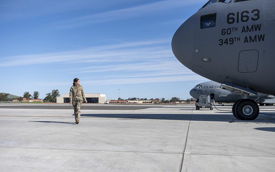 Capt. Sarah Aravich, 21st Airlift Squadron C-17 Globemaster III pilot, inspects the aircraft prior to departing Travis Air Force Base, Calif., on March 24, 2023. Members from the 21st AS, 860th Aircraft Maintenance Squadron, 60th Security Forces Squadron and 60th Air Mobility Wing flew to Vietnam and Hawaii, commemorating the 50th anniversary of Operation Homecoming. The operation brought 591 American prisoners of war back to the U.S. from Vietnam. 