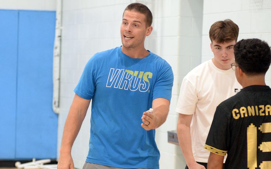 Tyler Greve gives instruction at practice.