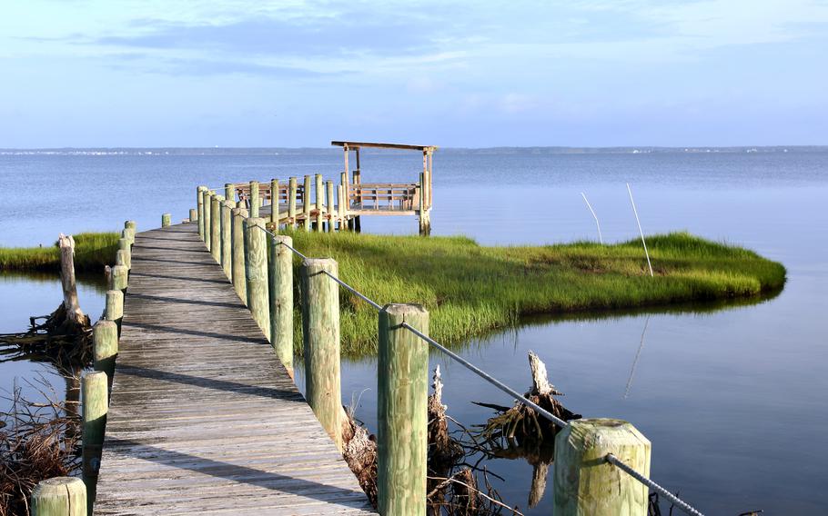 A dock extends off Chincoteague Island and into Chincoteague Bay.