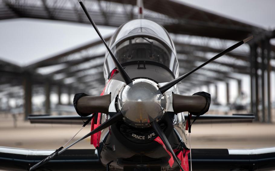 A T-6A Texan II rests under a hangar at Vance Air Force Base, Okla., Nov. 3, 2022.