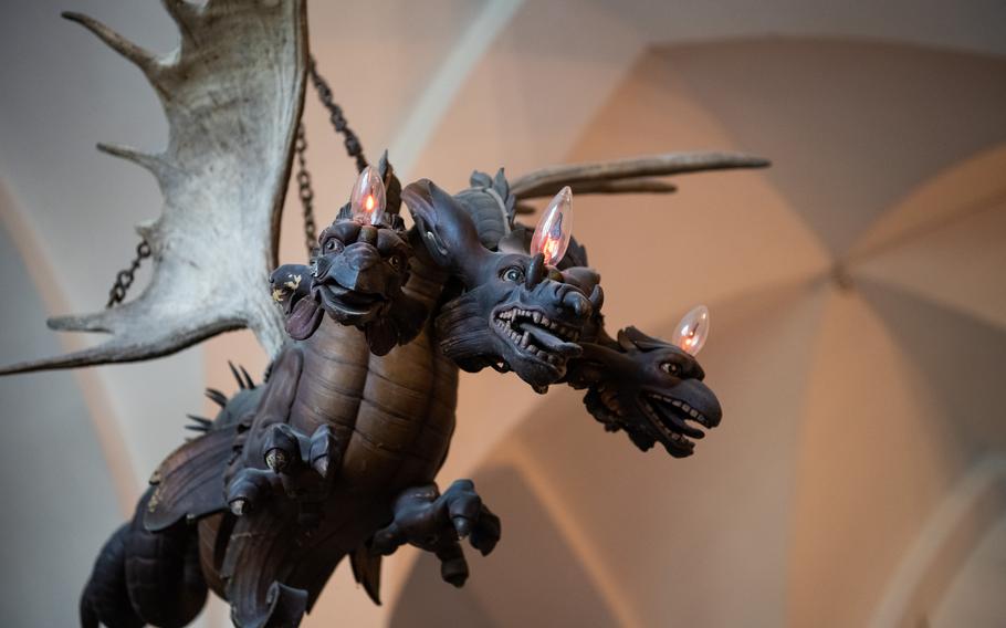 A chandelier at Reichenstein Castle on the Rhine River in southwestern Germany depicts a three-headed dragon and uses a pair of moose antlers for wings. 