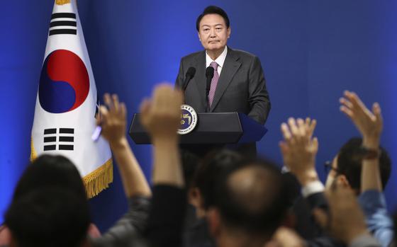 South Korean President Yoon Suk Yeol takes a question during a news conference to mark his first 100 days in office at the presidential office in Seoul, South Korea, Wednesday, Aug. 17, 2022. (Chung Sung-Jun/Pool Photo via AP)