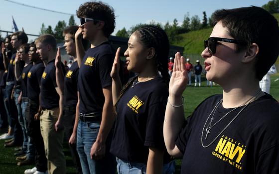 Future U.S. Navy sailors recite the oath of enlistment during a ceremony in Eagle River, Alaska, June 19, 2025. The Navy did not properly document how it turned around sluggish recruitment in 2024, according to a Defense Department Inspector General report dated June 27, 2025.