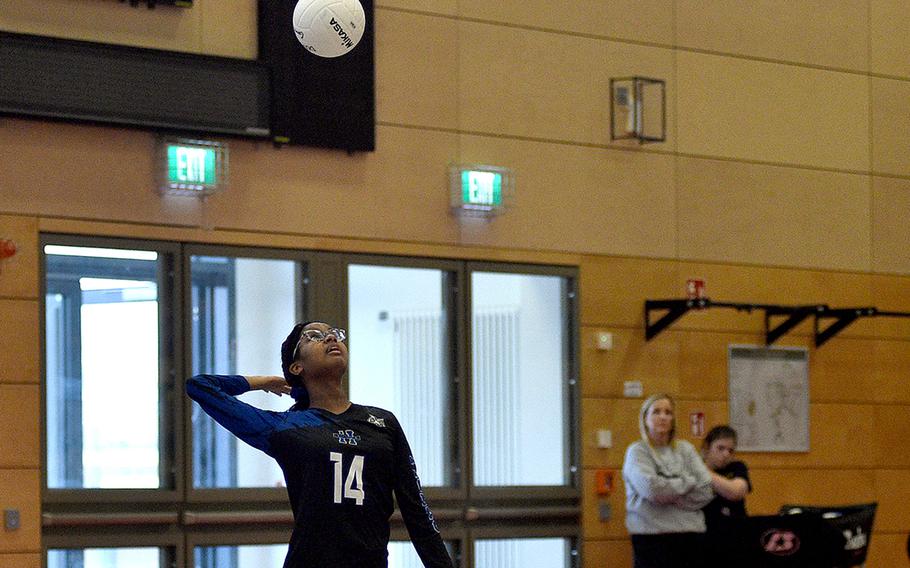 Hohenfels' Symphony Smith serves during the Tigers' last pool-play match against Alconbury during the DODEA European volleyball championships on Oct. 27, 2023, at Kaiserslautern High School in Kaiserslautern, Germany.