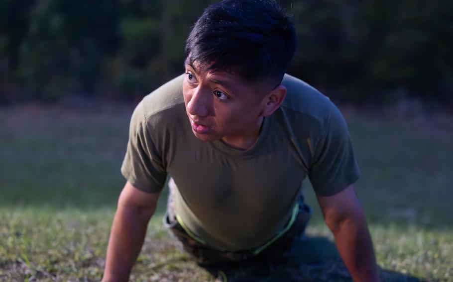 A Marine performs push-ups
