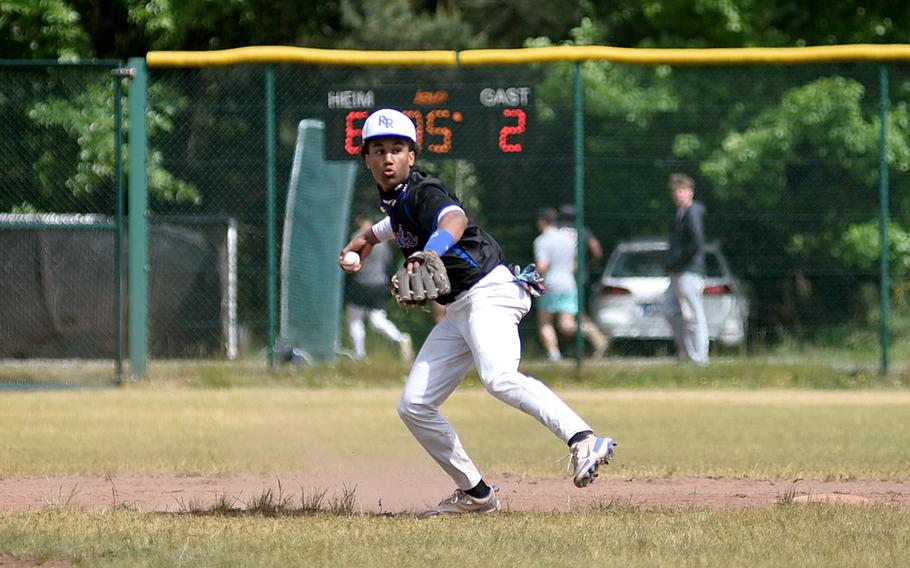 Ramstein shortstop Christian Roy throws the ball to first base for the putout during the Division I final against Kaiserslautern at the 2025 DODEA European baseball championships on May 23, 2025, at Southside Fitness Center on Ramstein Air Base, Germany.