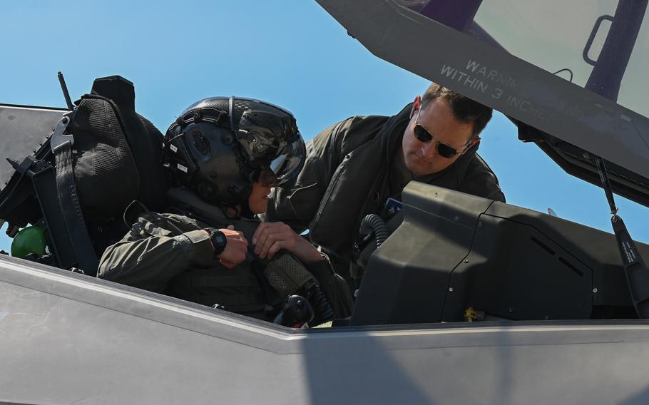 Maj. Jeffrey Witt, an F-35A Lightning II instructor pilot, guides Capt. Stefan Johansson at Volk Field Air National Guard Base, Wis., Aug. 15, 2023. The Air Force may begin training warrant officers again for the first time in decades, some of whom could be used as instructor pilots.