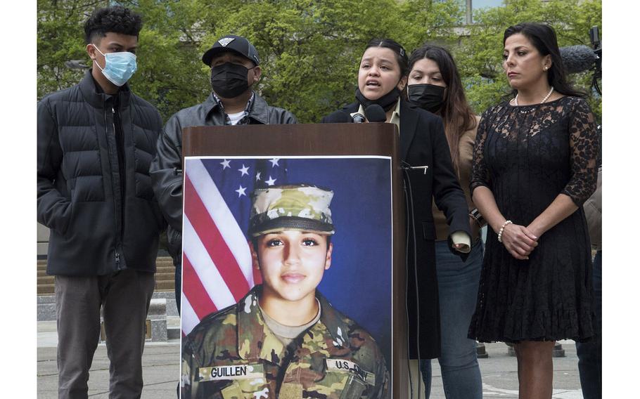 Backed by other family members and attorney Natalie Khawam, right, Army Spc. Vanessa Guillen’s sister, Lupe, speaks at a news conference marking the first anniversary of the Fort Hood soldier’s killing, April 22, 2021, at the Navy Memorial in Washington, D.C. 