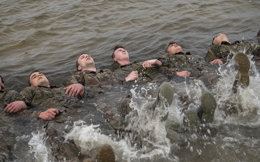 U.S. Air Force special tactics and combat rescue officer candidates perform flutter-kicks during the assessment and selection process at Hurlburt Field, Fla., on March 25, 2021. 