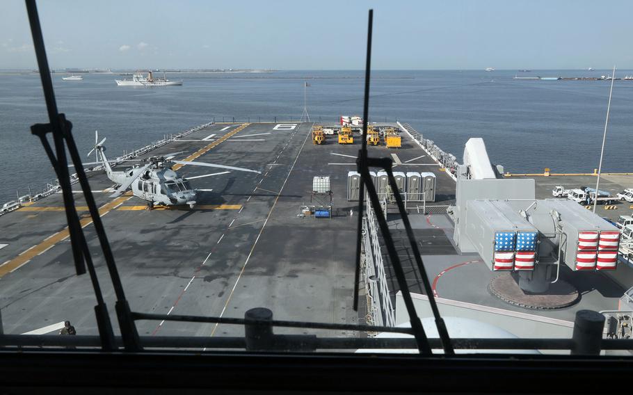 The amphibious assault ship USS America docks at Manila's South Harbor, Tuesday, March 21, 2023.