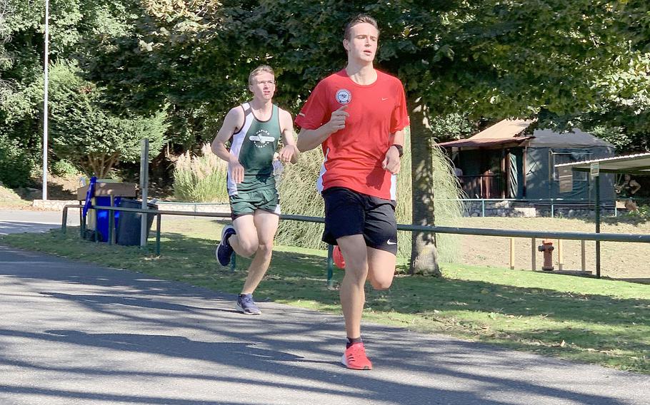 Naples' Andrew Scarff trails American Overseas School of Rome's Nicolo Caccamo in the boys race on Saturday, but went on to finish in first place. Scarff hasn't lost this season.
