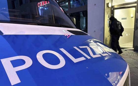 A police vehicle stands on the street during a raid in Berlin-Adlershof in Berlin, Thursday, Nov. 23, 2023.  Hundreds of police officers searched the properties of Hamas members and followers in Germany on Thursday morning with the majority of the raids taking place in Berlin.(Sven Kaeuler/dpa via AP)
