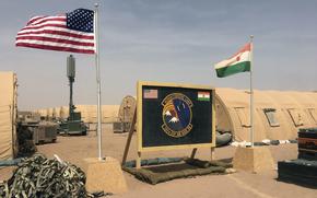 FILE - A U.S. and Niger flag are raised side by side at the base camp for air forces and other personnel supporting the construction of Niger Air Base 201 in Agadez, Niger, April 16, 2018. The United States is attempting to create a new military agreement with Niger that would allow it to remain in the country, weeks after the junta said its presence was no longer justified, two Western officials told The Associated Press Friday April 19, 2024. (AP Photo/Carley Petesch, File)