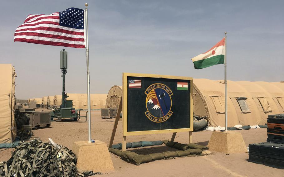 U.S. and Niger flags are raised at the base camp for air forces and other personnel supporting the construction of Niger Air Base 201 in Agadez, Niger, April 16, 2018. 