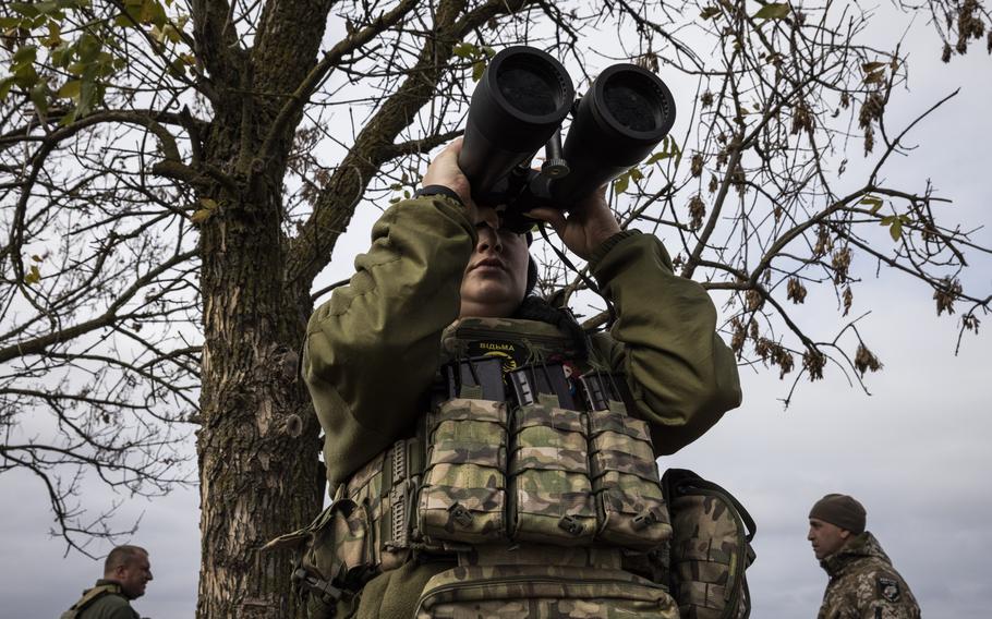 A Ukrainian soldier watches for Russian drones in the Kherson region of Ukraine.