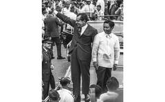 Juanito M. Pardico/Stars and Stripes
Manila, Philippines, July, 1969: President Richard Nixon and Philippine President Ferdinand Marcos wave to the crowd from atop the hood of their car.