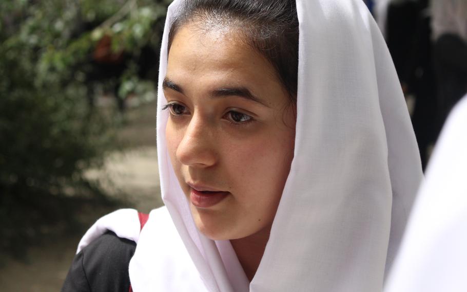 Safia Hussain, 18, speaks with her Best Friend Group at Zarghoona High School on July 28 in Kabul.