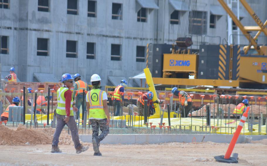 Construction workers build Marine Corps barracks at Camp Blaz, Guam, on Nov. 30.