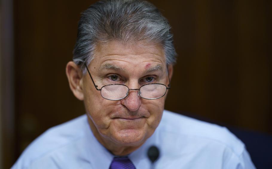 In this Aug. 5, 2021, photo, Sen. Joe Manchin, D-W.Va., prepares to chair a hearing in the Senate Energy and Natural Resources Committee. Manchin said Sept. 2, 2021, that Congress should take a “strategic pause” on more spending, warning that he does not support President Joe Biden's plans for a sweeping $3.5 trillion effort to rebuild and reshape the economy.