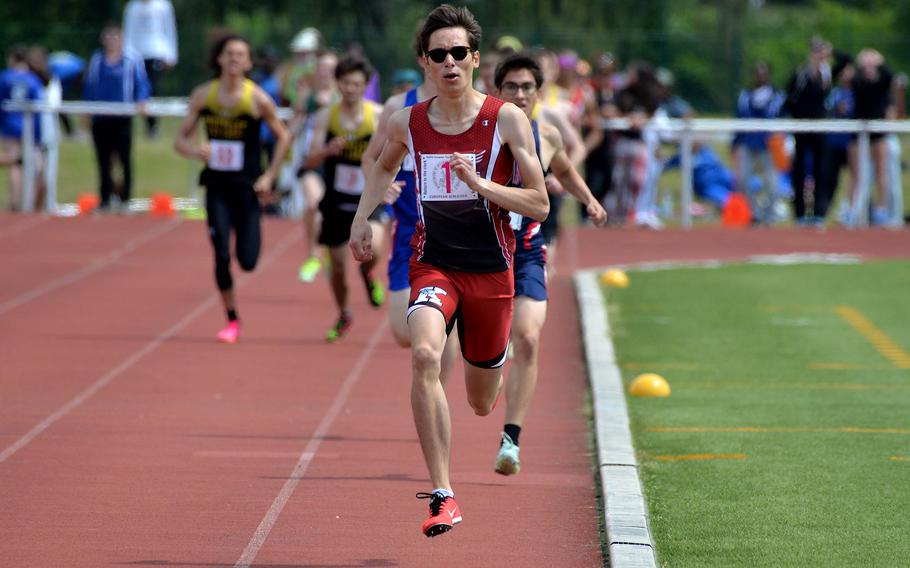Brandon Seyler of Kaiserslautern leads the pack on his way to winning the boys 800-meter race at the DODEA-Europe track and field championships in Kaiserslautern, Germany, May 20, 2023, in 1 minute, 59.79 seconds.