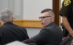 Volodymyr Zhukovskyy, of West Springfield, Mass., center right, charged with negligent homicide in the deaths of seven motorcycle club members in a 2019 crash, speaks with defense attorney Steve Mirkin, left, at Coos County Superior Court, in Lancaster, N.H., Monday, July 25, 2022.    The prosecution has rested Zhukovskyy's case on Wednesday, Aug. 3.   He faces negligent homicide and other charges in connection with the June 2019 crash in Randolph, New Hampshire.