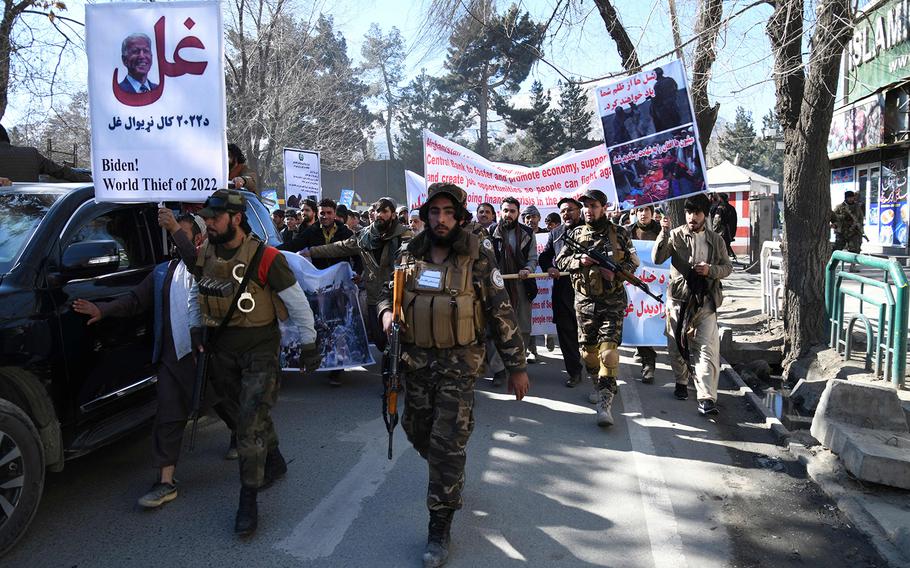 Protesters march during a demonstration against the recent remarks by U.S. President Joe Biden to freeze Afghanistan’s assets, in Kabul on Feb. 15, 2022. 