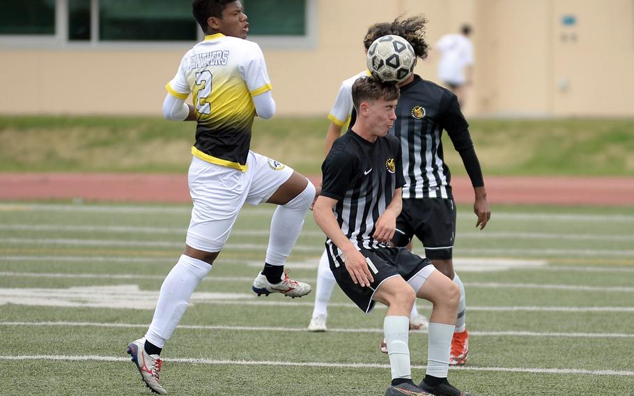 Matthew C. Perry's James Williams heads the ball in front of teammate Denzel Gray and Kadena's Derek Vaden during Thursday's All-DODEA-Japan soccer tournament. The Panthers won 1-0.