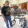Army veteran Daniel Melton prepares to fix another abandoned bicycle at Camp Humphreys, South Korea, Sept. 12, 2023. 
