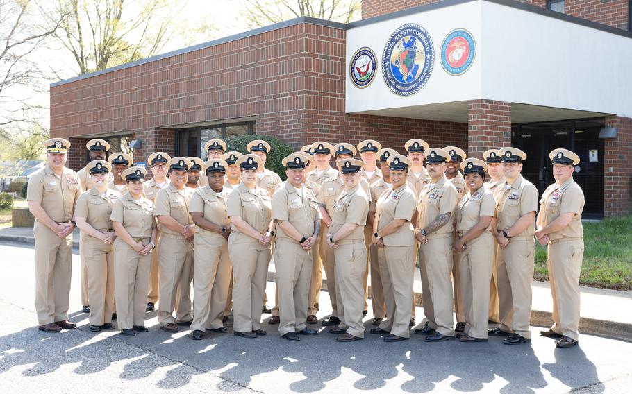 A group of Navy chiefs pose for a photo