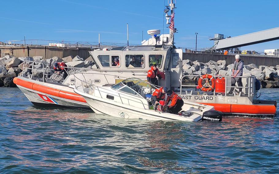 Crews with the United States Coast Guard, with the help of two good Samaritans, rescued three adults and a child who were adrift in their small boat near the Chesapeake Bay Bridge-Tunnel Sunday afternoon, Dec. 4, 2022.