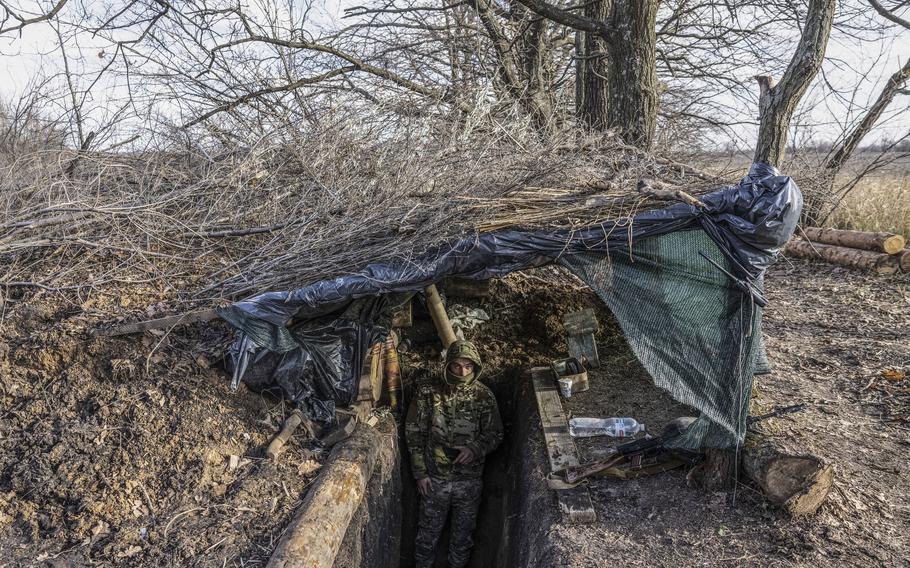 A Ukrainian soldier in the entrance to a bunker at a military position in the Zaporizhzhia region on Nov. 30. 