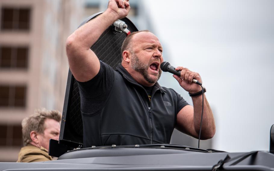 In this file photo, Infowars host Alex Jones arrives at the Texas State Capital building on April 18, 2020 in Austin, Texas. The protest was organized by Infowars host Owen Shroyer who is joining other protesters across the country in taking to the streets to call for the country to be opened up despite the risk of the COVID-19. 