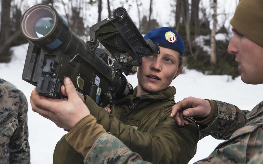 U.S. Marine Lance Cpl. Dylan Pennington discusses the functions of the FIM-92 Stinger missile system with Norwegian army Sgt. Silje Skarsbakk during training in Setermoen, Norway, in April 2022. U.S. foreign arms sales increased by nearly 50% in 2022 over the previous year, U.S. officials said this week, with Stingers being one of the popular systems.