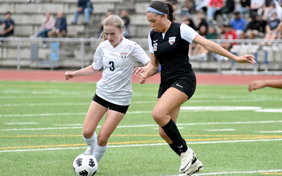 Kaiserslautern forward Kristine Svendsen and Stuttgart defender Serenity Brown tossle for the ball during a semifinal match at the DODEA Division I European championships May 22, 2024, at Ramstein High School on Ramstein Air Base, Germany.