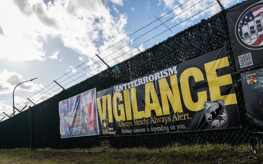 A sign at the Army’s Rhine Ordnance Barracks in Kaiserslautern, Germany, as seen March 14, 2023, reminds the public to be vigilant.