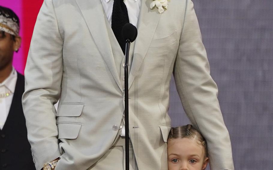 Drake accepts the artist of the decade award as he holds his son Adonis Graham at the Billboard Music Awards on Sunday, May 23, 2021, at the Microsoft Theater in Los Angeles. 