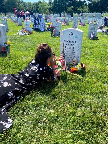 Ashleigh Carlin visits her brother’s grave in Section 60 at Arlington National Cemetery. At age 19, Army Cpl. Michael Pursel was killed in Iraq in 2007.